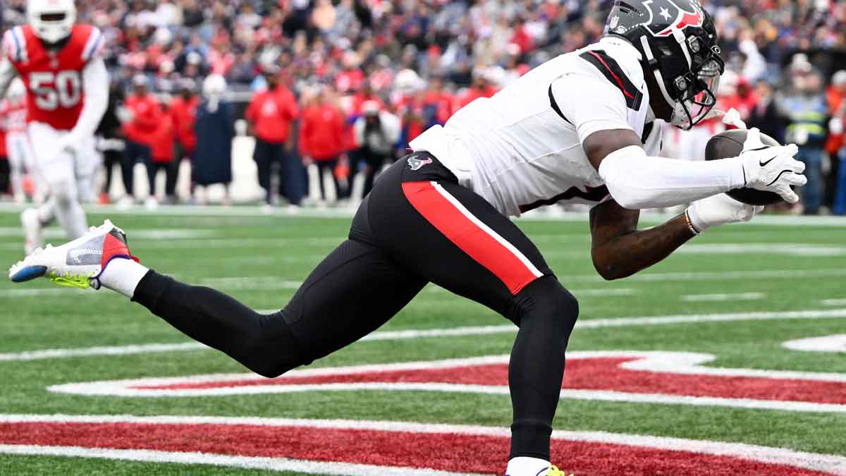 Oct 13, 2024; Foxborough, Massachusetts, USA; Houston Texans wide receiver Stefon Diggs (1) makes a catch for a touchdown against the New England Patriots during the second half at Gillette Stadium. 