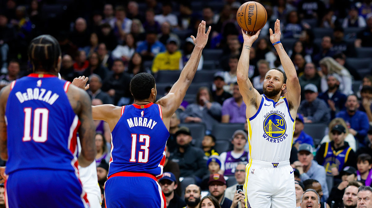 Golden State Warriors guard Stephen Curry (30) shoots the ball against Sacramento Kings forward Keegan Murray (13) during the third fourth quarter at Golden 1 Center. 