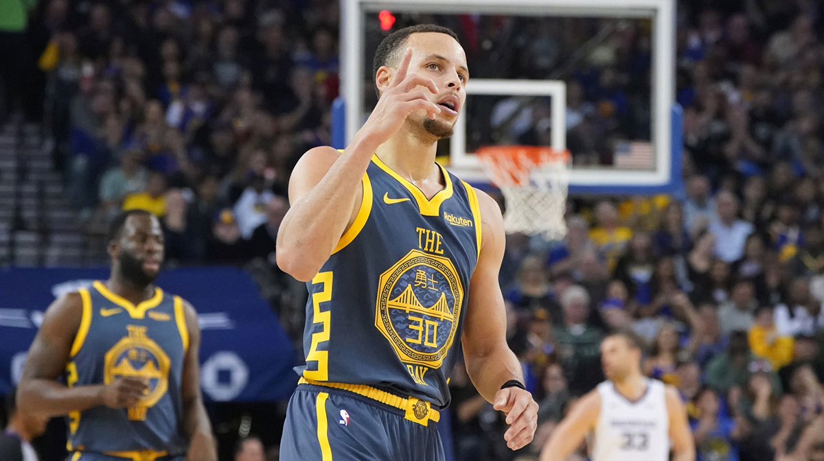 Golden State Warriors guard Stephen Curry (30) celebrates after recording his 15,000 career point against the Memphis Grizzlies during the second quarter at Oracle Arena.