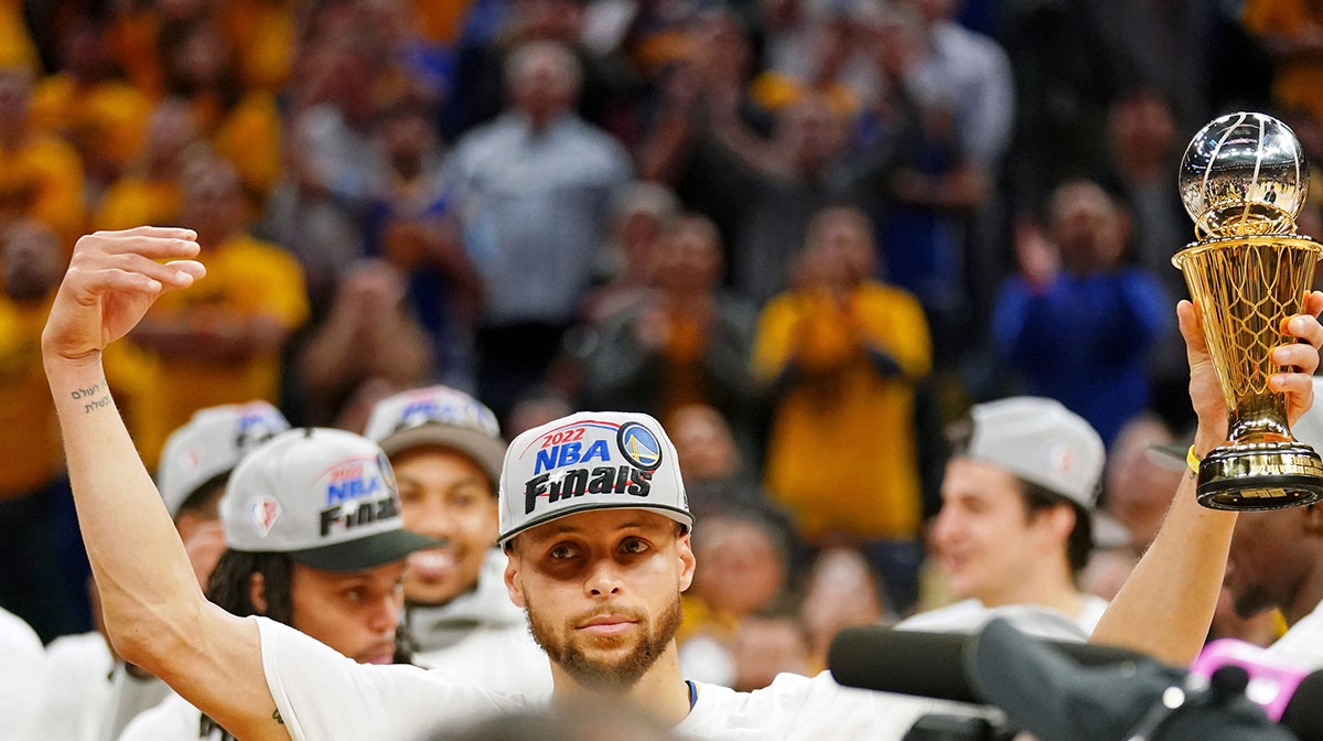 Golden State Warriors guard Stephen Curry (30) reacts after he was named the Magic Johnson western conference MVP after winning game five of the 2022 western conference finals against the Dallas Mavericks at Chase Center.