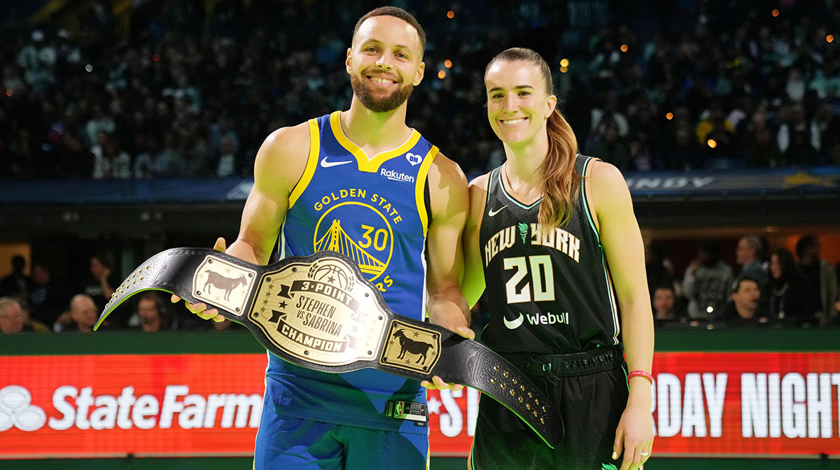 Golden State Warriors guard Stephen Curry (30) and New York Liberty guard Sabrina Ionescu (20) after the Stephen vs Sebrina three-point challenge during NBA All Star Saturday Night at Lucas Oil Stadium.