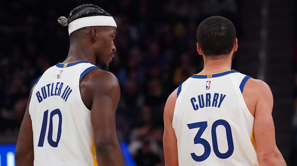  Golden State Warriors forward Jimmy Butler III (10) talks with guard Stephen Curry (30) during a game against the Detroit Pistons in the second quarter at Chase Center.