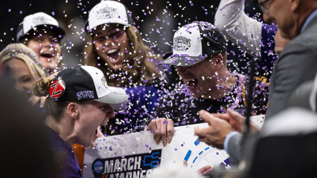 TCU Horned Frogs center Sedona Prince (13) and head coach Mark Campbell celebrate after defeating the Baylor Lady Bears.