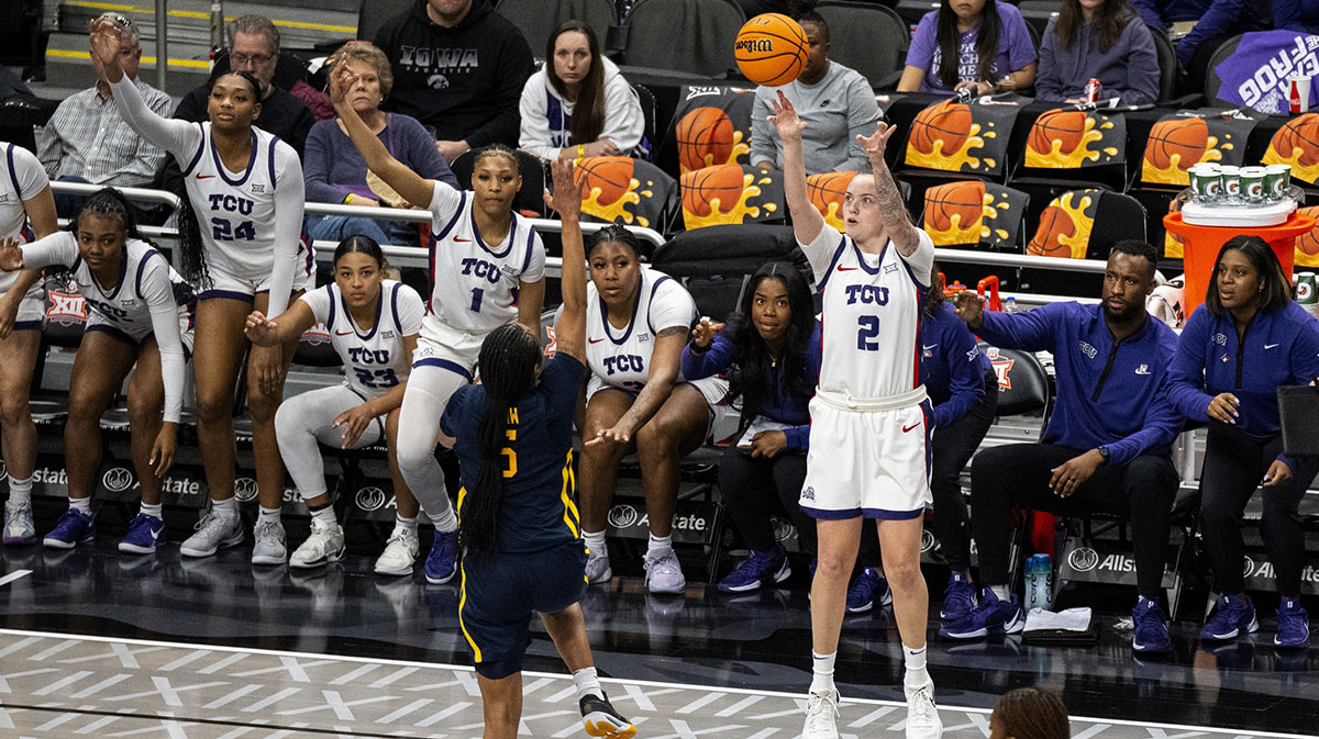 TCU Horned Frogs guard Madison Conner (2) attempts a three pointer against West Virginia Mountaineers guard Sydney Shaw (5) during the second half at T-Mobile Center.