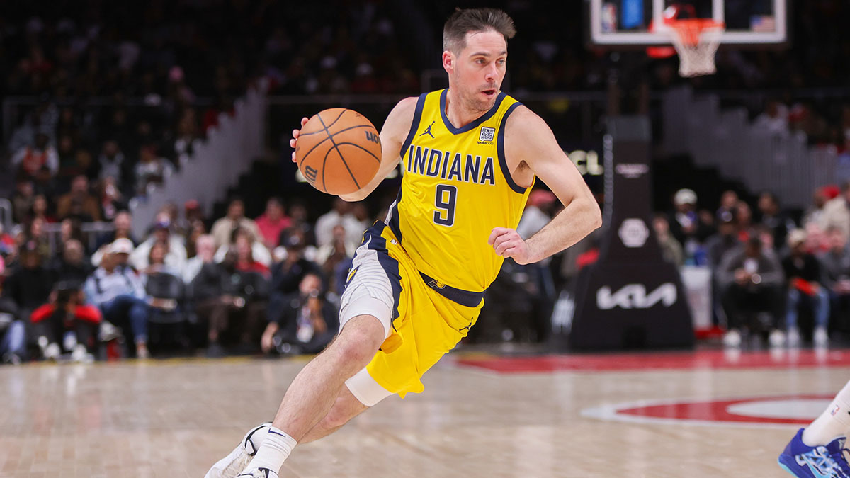 Indiana Pacers guard T.J. McConnell (9) drives to the basket against the Atlanta Hawks in the fourth quarter at State Farm Arena.