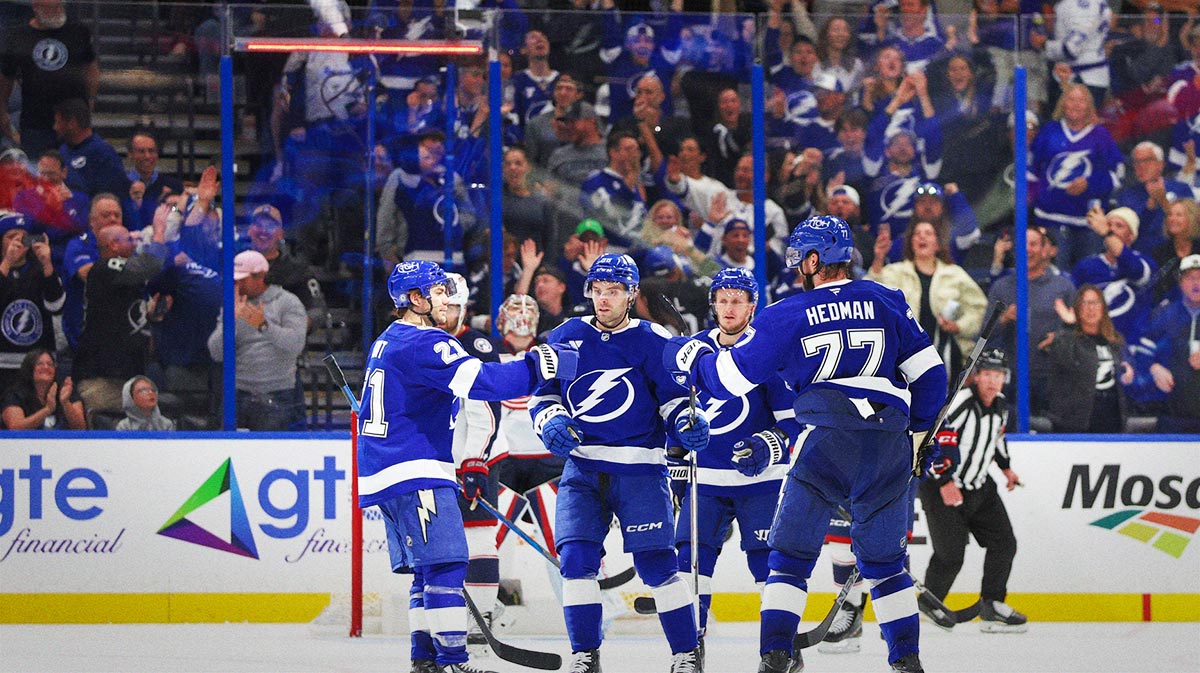 Tampa Bay Lightning defenseman Victor Hedman (77) celebrates with center Brayden Point (21) and left wing Brandon Hagel (38) after scoring a goal against the Columbus Blue Jackets in the third period at Amalie Arena.