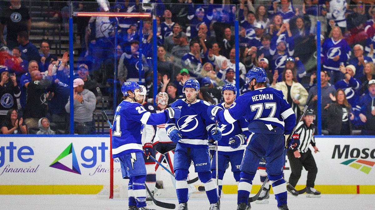 Tampa Bay Lightning defenseman Victor Hedman (77) celebrates with center Brayden Point (21) and left wing Brandon Hagel (38) after scoring a goal against the Columbus Blue Jackets in the third period at Amalie Arena.