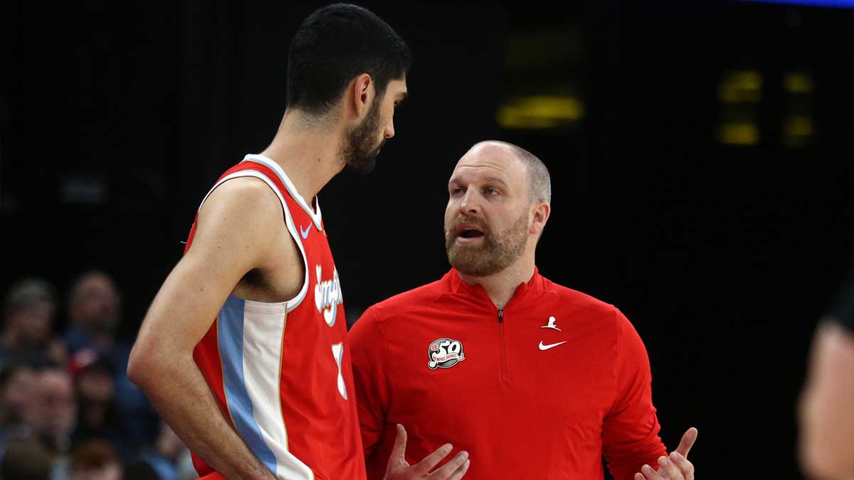 Memphis Grizzlies head coach Taylor Jenkins talks with forward Santi Aldama (7) during the fourth quarter against the San Antonio Spurs at FedExForum.