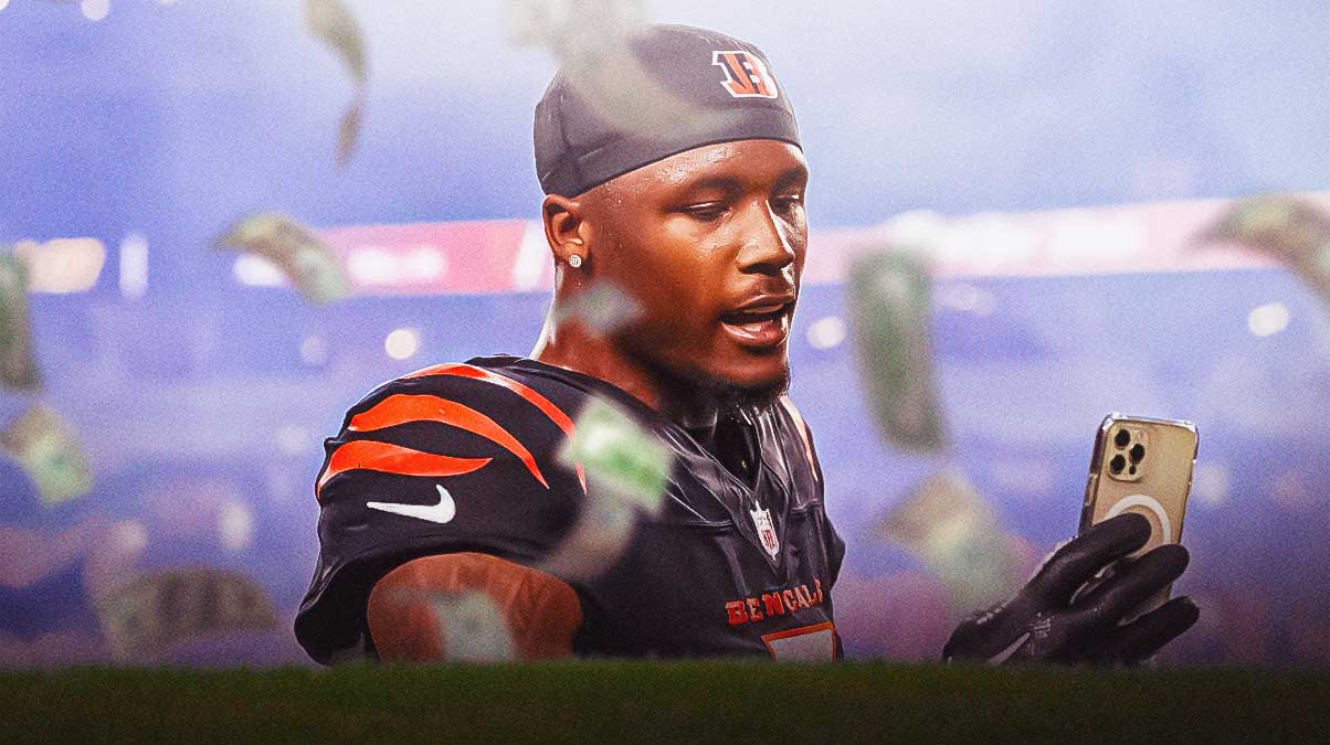 Tee Higgins in a Bengals uniform with money falling down
