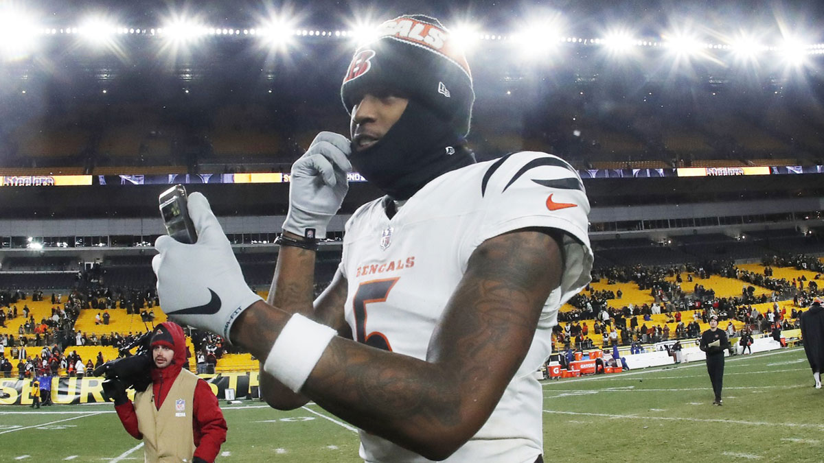 Cincinnati Bengals wide receiver Tee Higgins (5) goes live on social media after defeating the Pittsburgh Steelers at Acrisure Stadium.