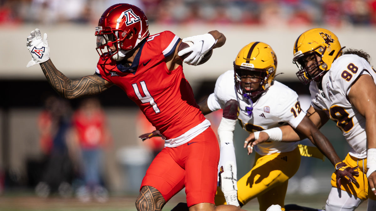Nov 30, 2024; Tucson, Arizona, USA; Arizona Wildcats wide receiver Tetairoa McMillan (4) against the Arizona State Sun Devils in the first half during the Territorial Cup at Arizona Stadium.
