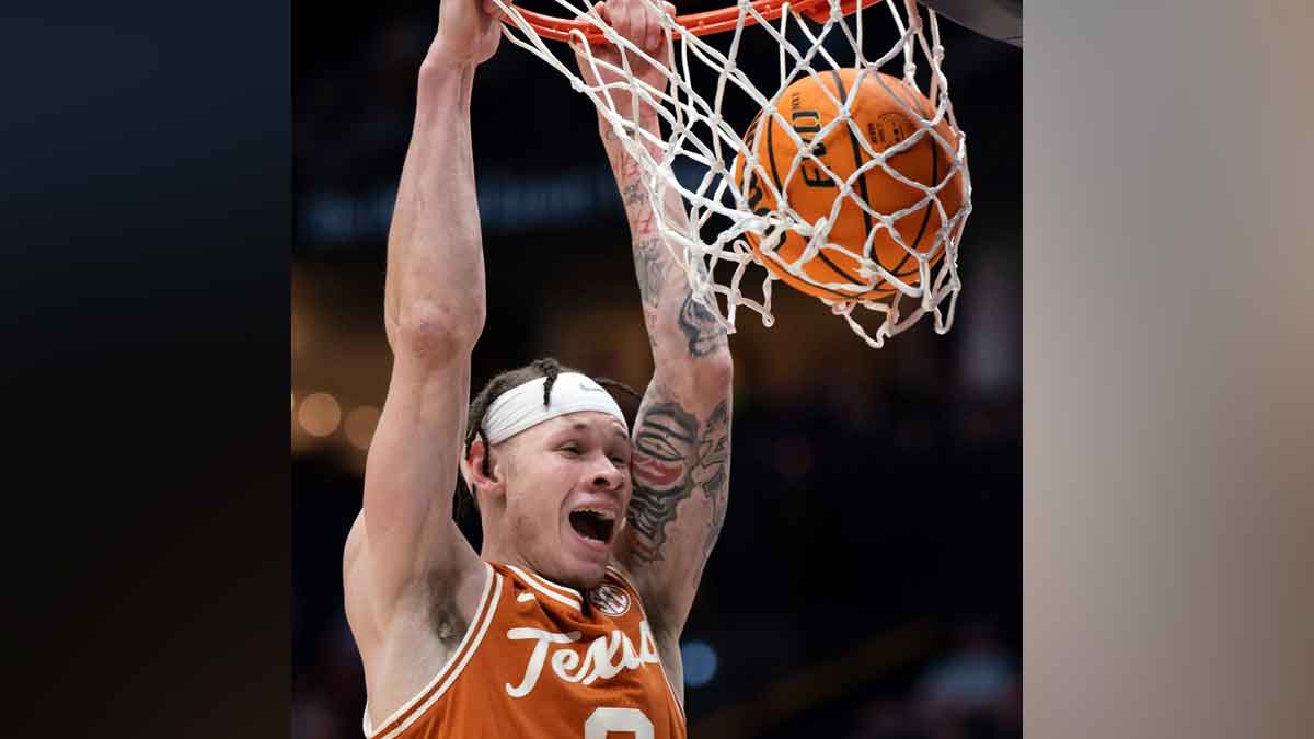 Texas Longhorns guard Chendall Weaver (2) dunks against Texas A&M during their second round game of the SEC Men's Basketball Tournament at Bridgestone Arena in Nashville, Tenn., Thursday, March 13, 2025.