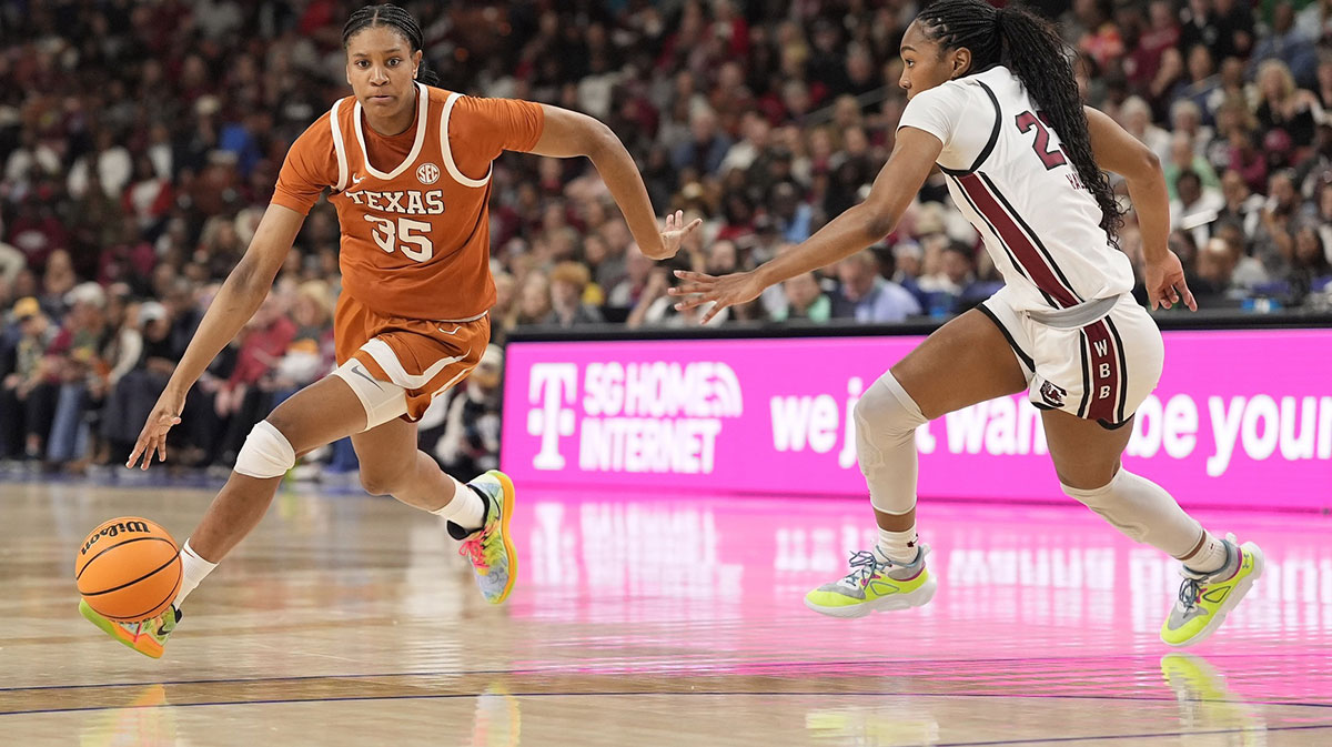 Texas women's basketball forward Madison Booker (35) goes to the basket defended but South Carolina Gamecocks guard Bree Hall (23) during the first half at Bon Secours Wellness Arena