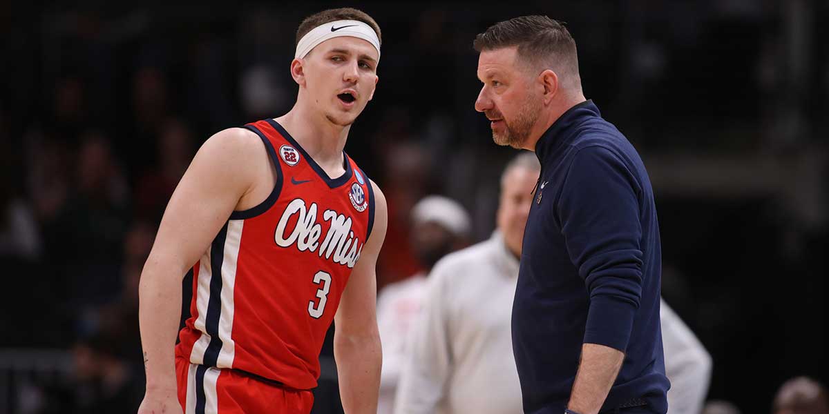Mississippi Rebels guard Sean Pedulla (3) talks to head coach Chris Beard in the first half of a South Regional semifinal of the 2025 NCAA tournament against the Michigan State Spartans at State Farm Arena.