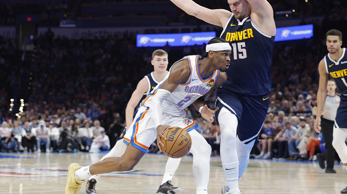 Shai Gilgeous-Alexander (2) Drive against Denver Nuggets Center Nikola Jokic (15) during the second half in Center Pacom