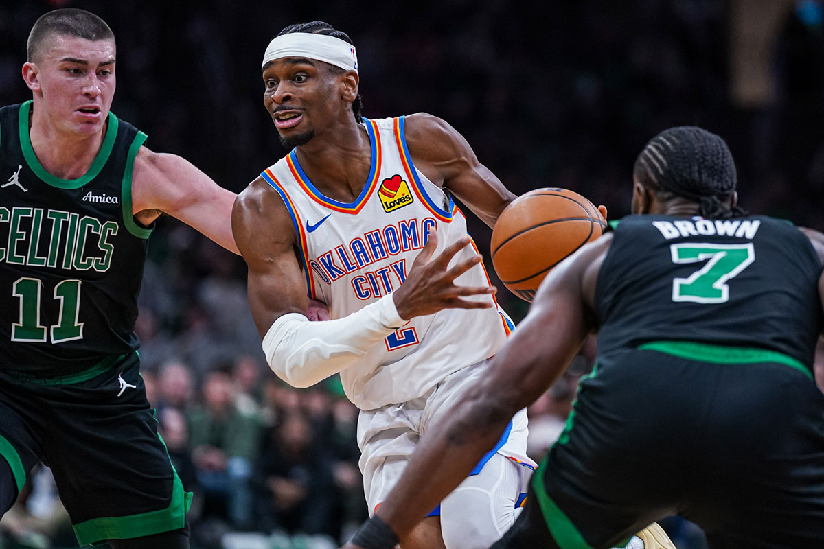 Thunder Guard Shai Gilgeous-Alexander (2) Drive the ball against Boston Celtics Payton Pritchard (11) and stores Jailena Brauna (7) in the third quarter in TD Garden