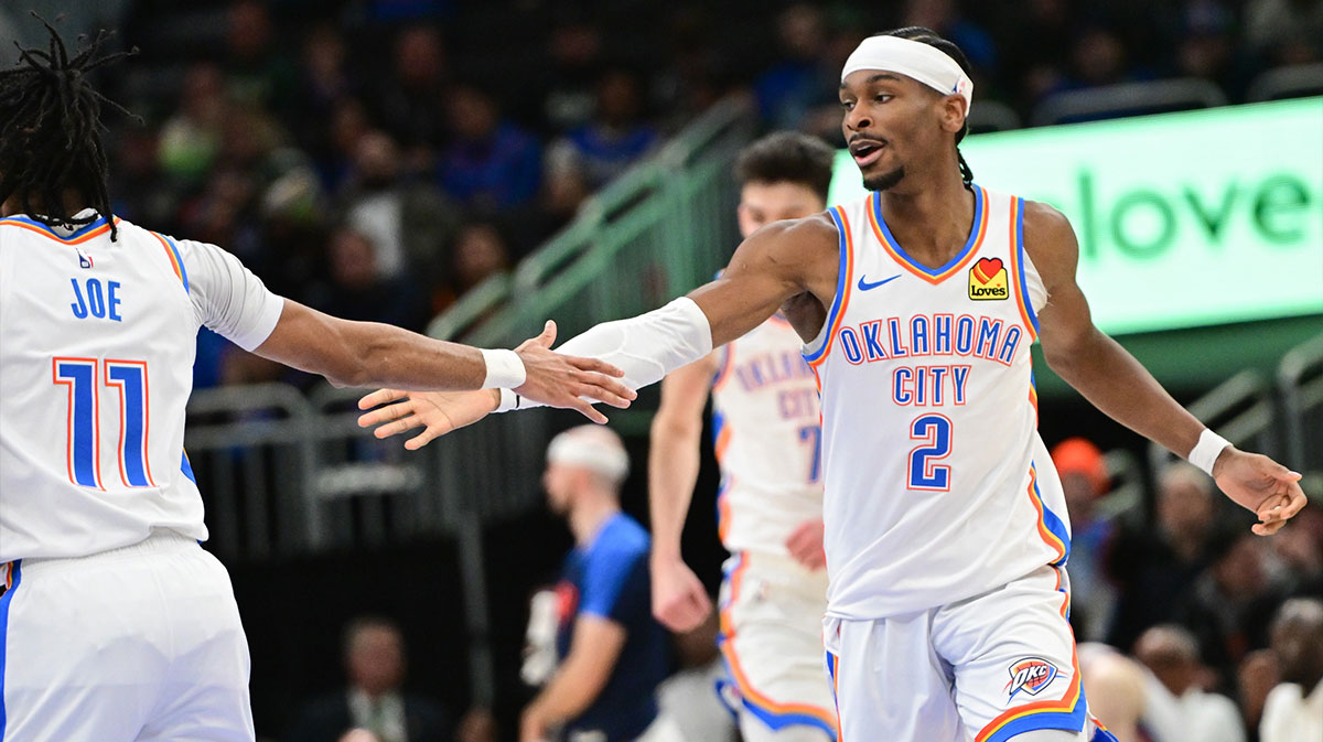 Thunder guard Shai Gilgeous-Alexander (2) celebrates with guard Isaiah Joe (11) after score in the fourth quarter against the Milwaukee Bucks at Fiserv Forum