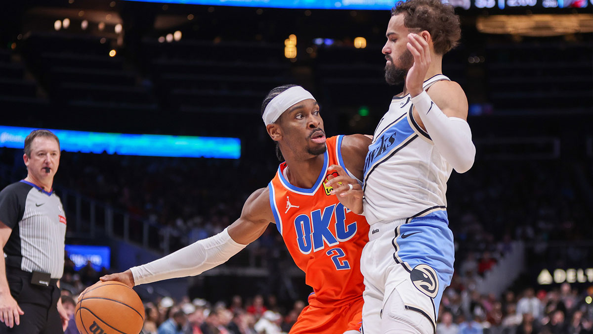 Thunder Guard Shai Gilgeous-Alexander (2) Defend Atlanta Hawks Guard Trae Young (11) in the second quarter on the State Farm Arena