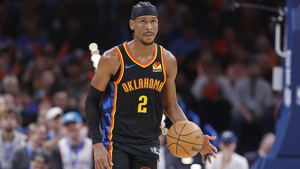 Thunder guard Shai Gilgeous-Alexander (2) dribbles down the court against the Denver Nuggets during the second half at Paycom Center