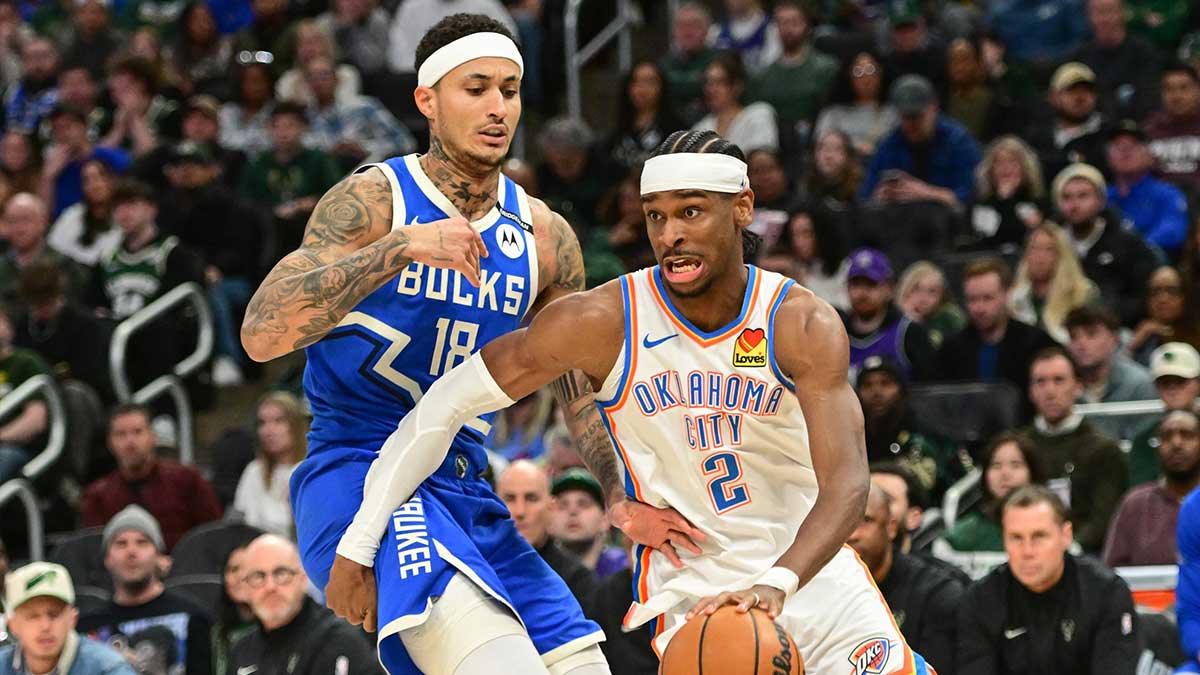 Thunder guard Shai Gilgeous-Alexander (2) drives for the basket against Milwaukee Bucks forward Kyle Kuzma (18) in the second quarter at Fiserv Forum