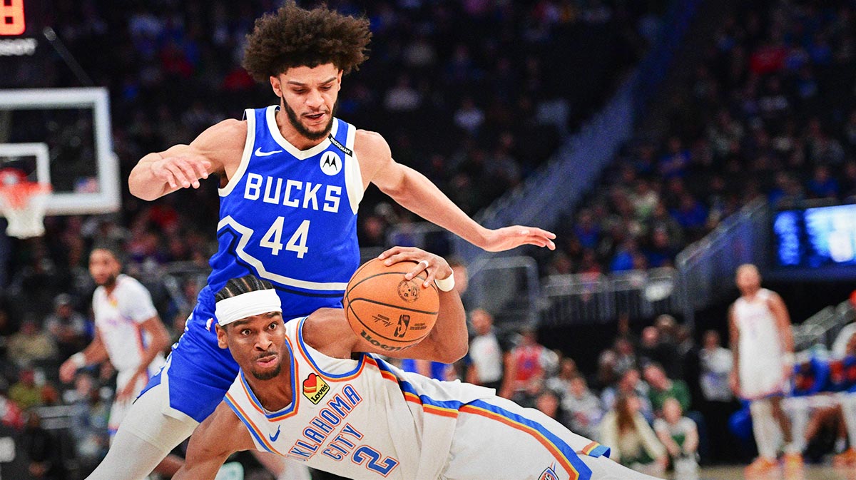 Thunder center Isaiah Hartenstein (55) gestures towards forward Chet Holmgren (7) after a play against the Toronto Raptors during the second half at Paycom Center