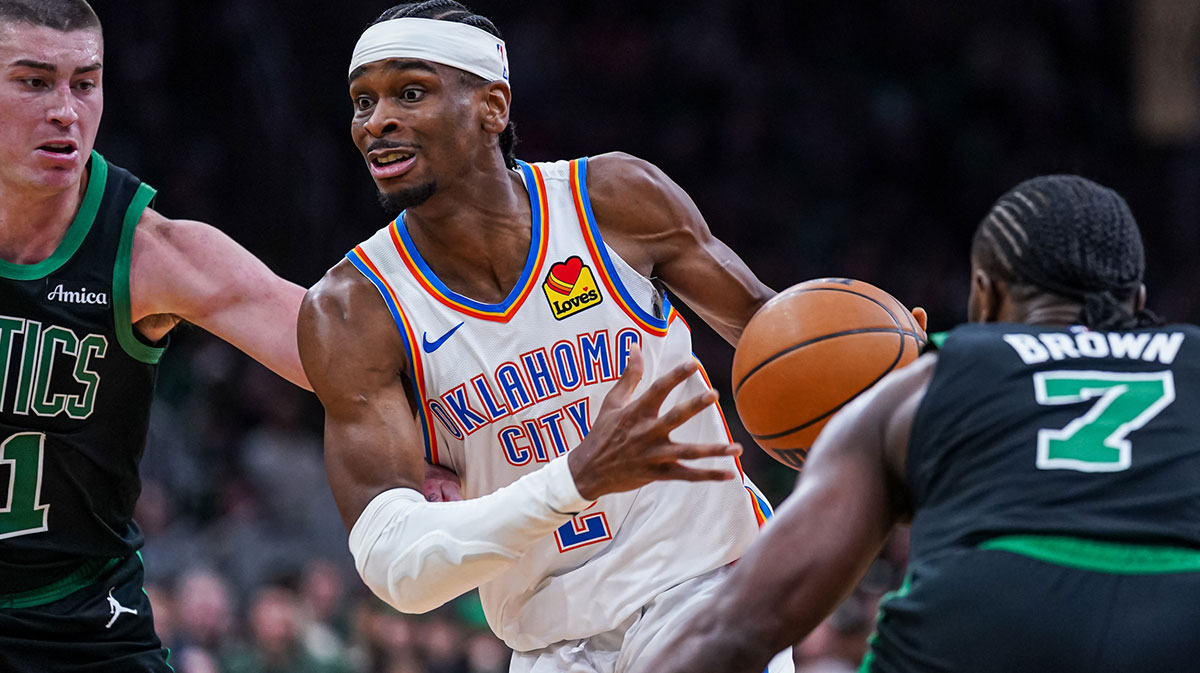 Thunder Guard Shai Gilgeous-Alexander (2) Drive the ball against Boston Celtics Payton Pritchard (11) and stores Jailena Brauna (7) in the third quarter in TD Garden