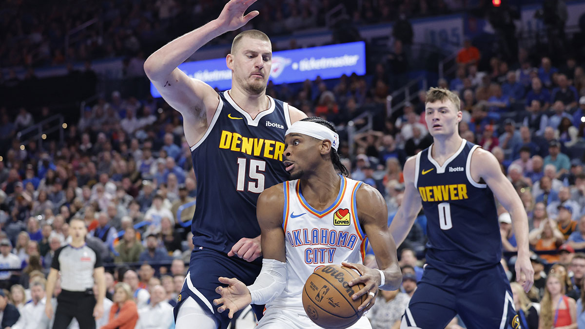 Nuggets Center Nikola Jokić (15) Defend Drive by Oklahoma City Thunder Guard Shai Gilgeous-Alexander (2) During the second half in Center Pacom