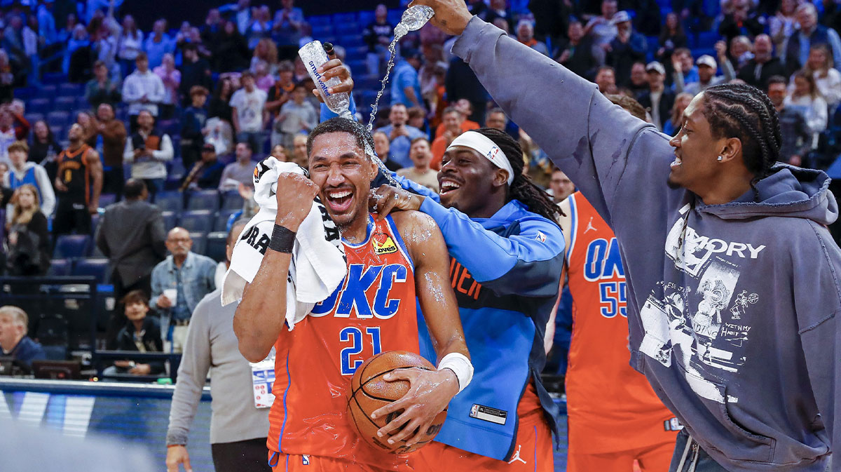 Thunder guard Aaron Wiggins (21) gets water poured on him by his teammates after his performance against the Sacramento Kings during the second half at Paycom Center