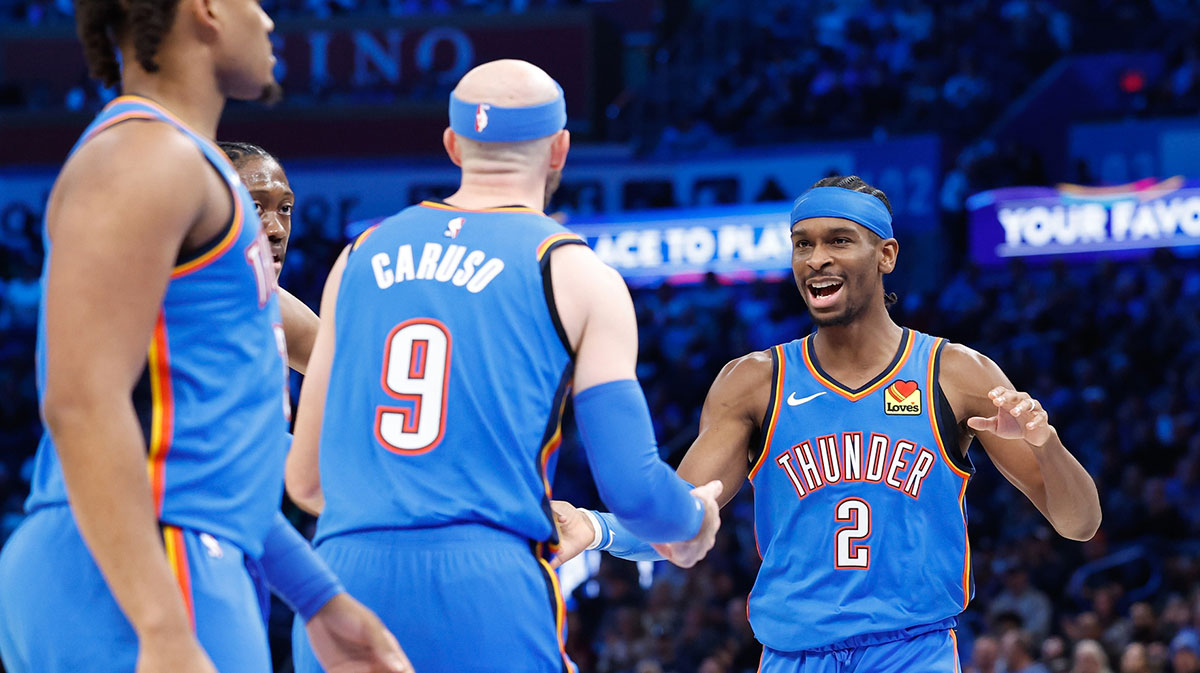 Thunder guard Shai Gilgeous-Alexander (2) celebrates with guard Alex Caruso (9) after a basket against the Dallas Mavericks during the second half at Paycom Center