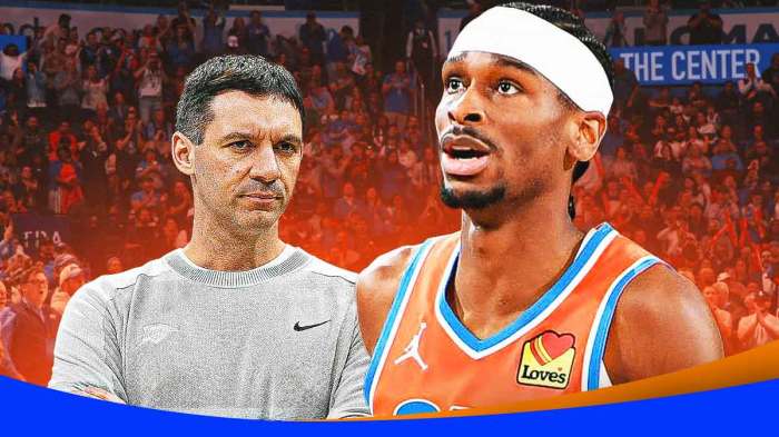 Mark Daigneault looking at Shai Gilgeous-Alexander. Thunder logo in the background.