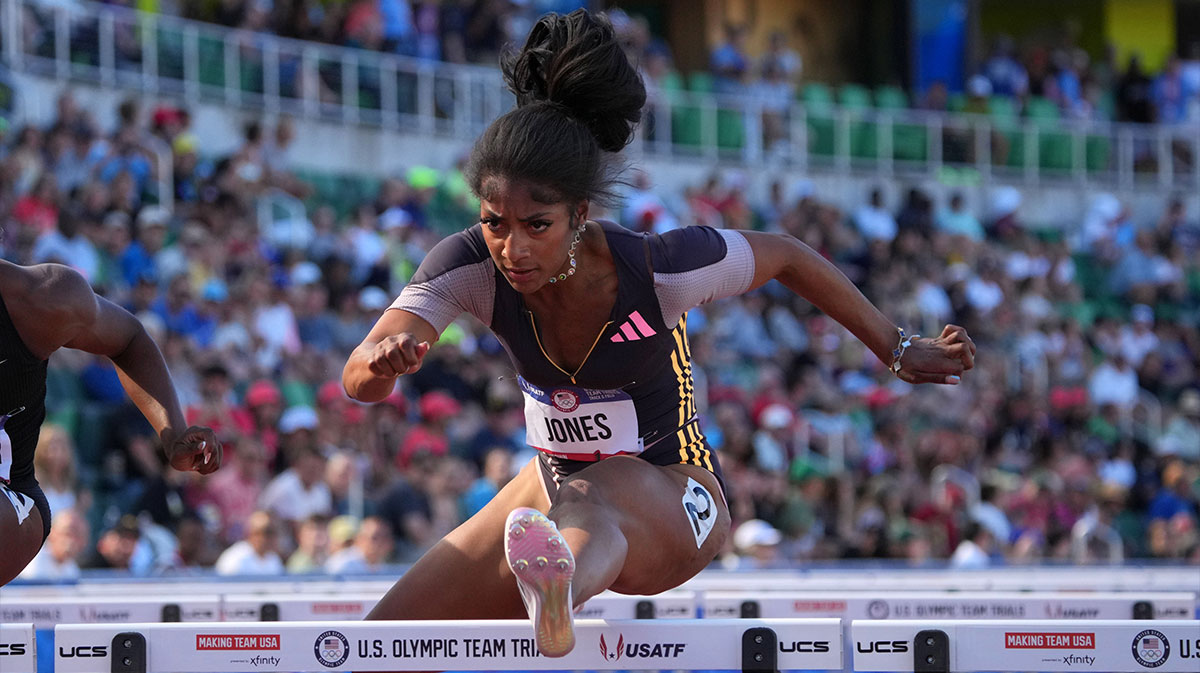 Tia Jones runs in a women's 100m hurdles heat during the US Olympic Team Trials at Hayward Field.