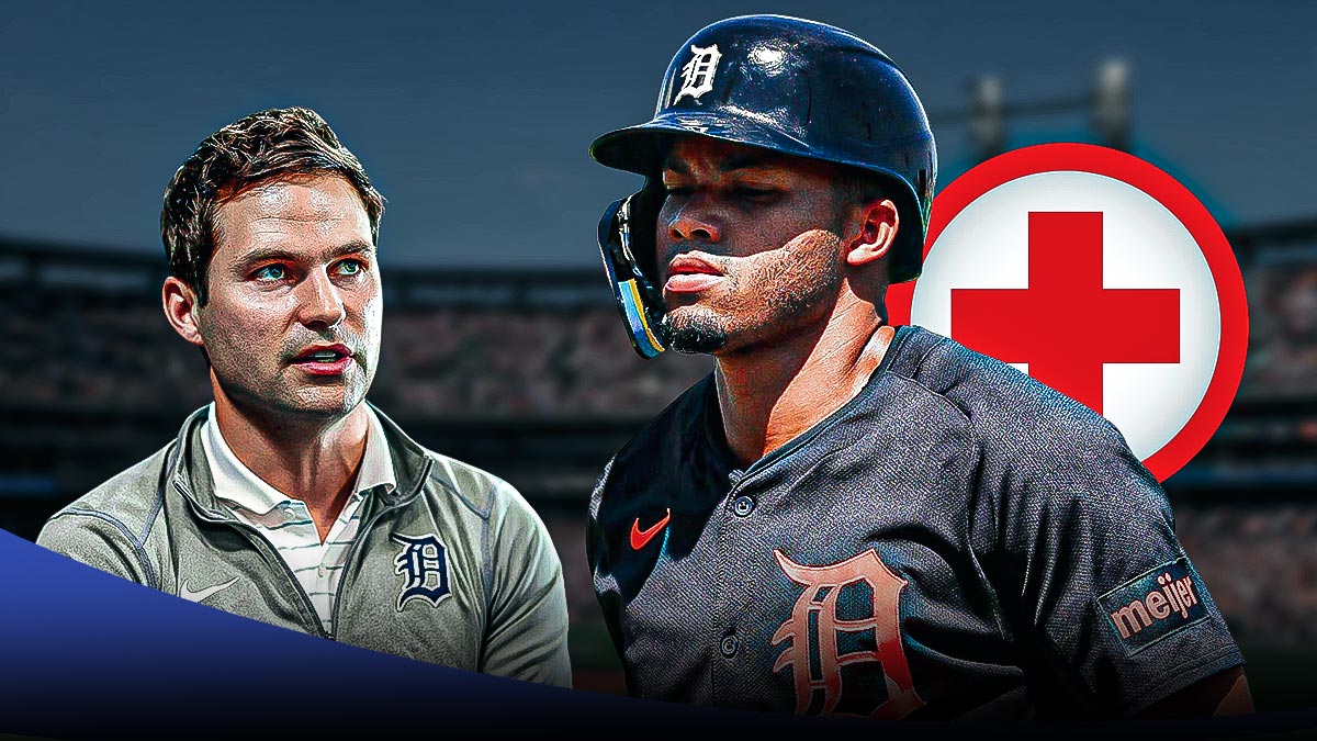 Tigers outfielder Wenceel Perez with an injury cross and Scott Harris.