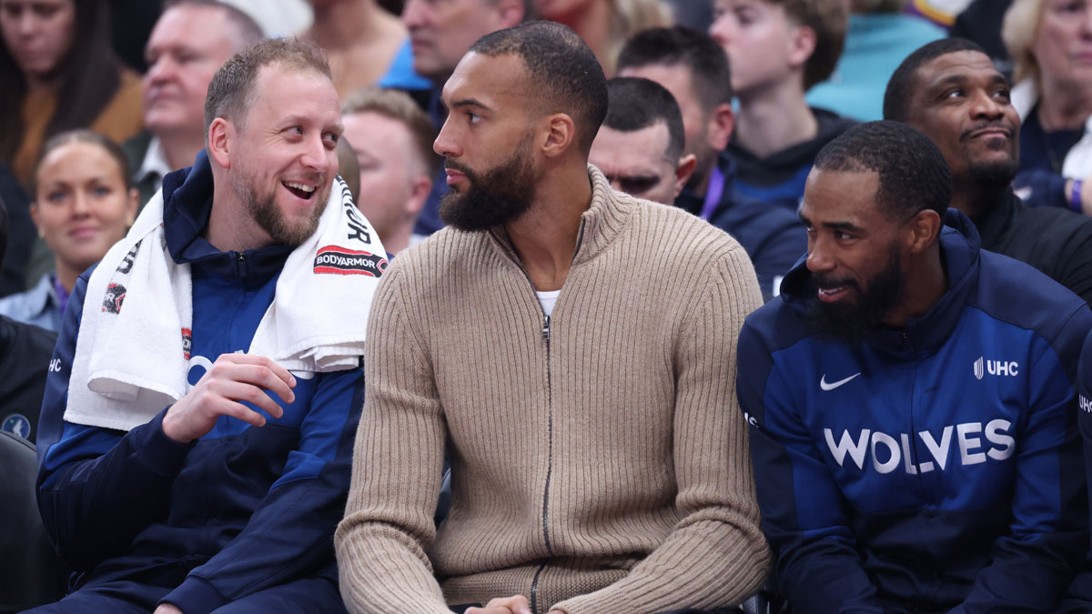 Timberwolves bench from left to right guard Joe Ingles, center Rudy Gobert and guard Mike Conley during the second quarter at Delta Center