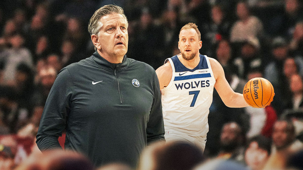 Chris Finch next to Joe Ingles on the Timberwolves court.