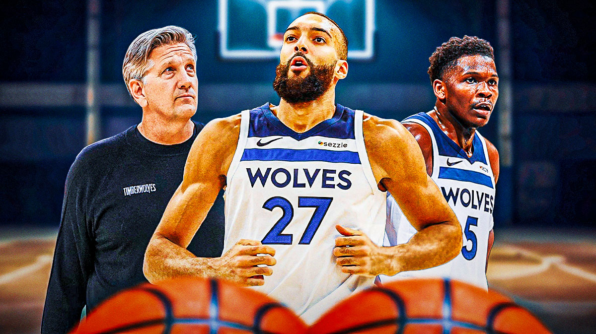 Minnesota Timberwolves star Rudy Gobert in the middle with Anthony Edwards and Chris Finch on either side in front of the Target Center.