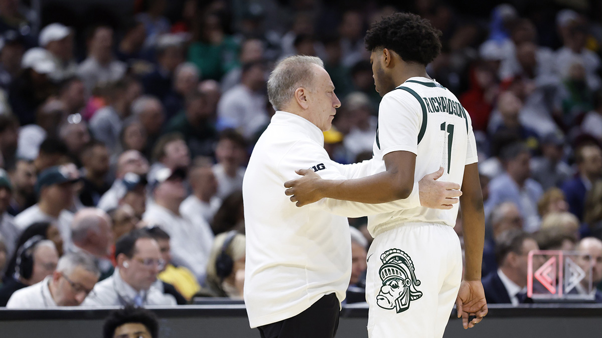 Michigan State Spartans head coach Tom Izzo talks with Michigan State Spartans guard Jase Richardson (11) in the first half against the Bryant University Bulldogs during the NCAA Tournament First Round at Rocket Mortgage Fieldhouse.