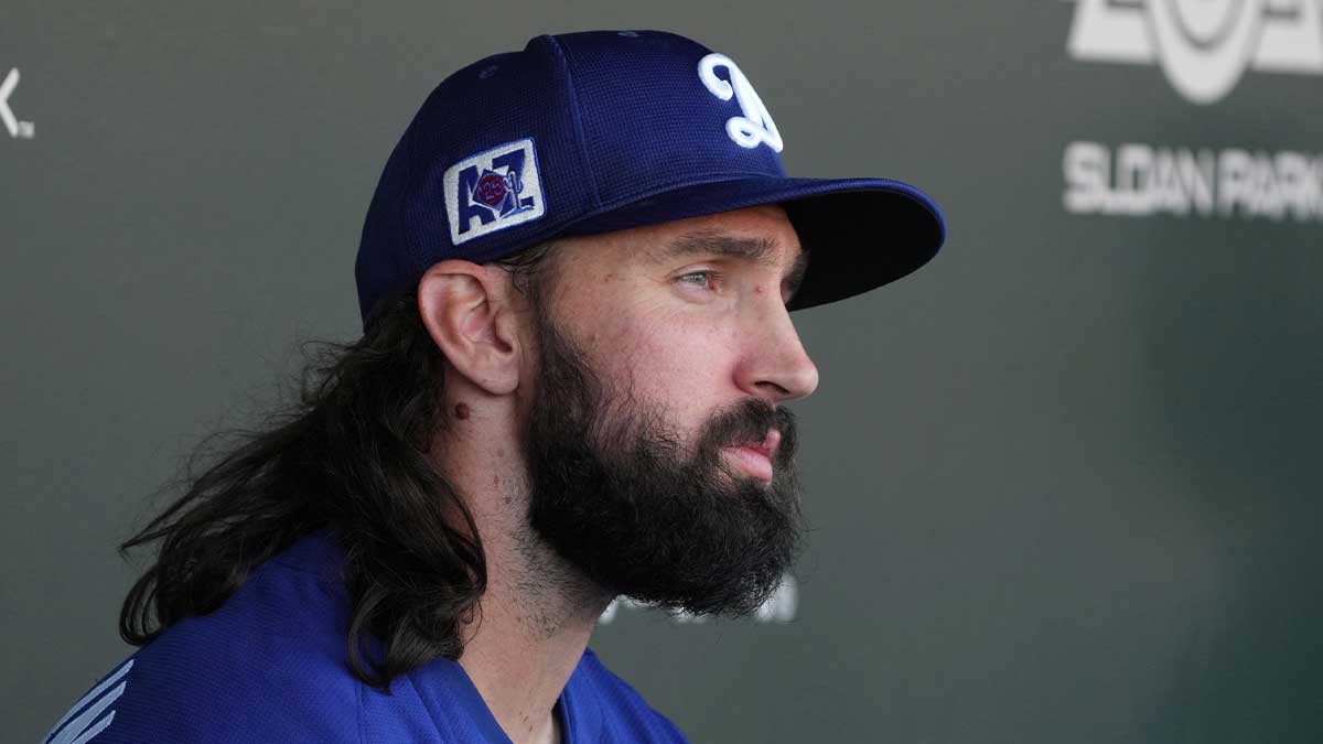 Los Angeles Dodgers pitcher Tony Gonsolin (26) sits in the dugout during the first inning against the Los Angeles Dodgers at Sloan Park. 