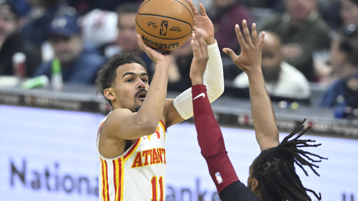 Atlanta Hawks guard Trae Young (11) shoots against Cleveland Cavaliers guard Darius Garland (10) in the first quarter at Rocket Mortgage FieldHouse.