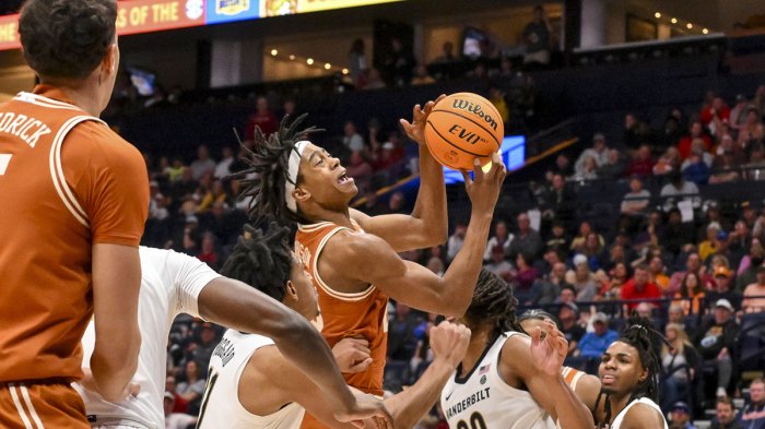 Texas Longhorns guard Tre Johnson (20) shoots over Vanderbilt Commodores guard AJ Hoggard (11) during the second half at Bridgestone Arena.