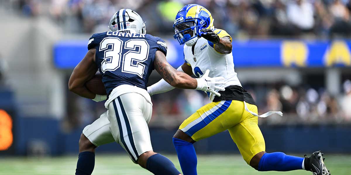 Dallas Cowboys running back Snoop Conner (32) runs the ball against Los Angeles Rams cornerback Tre Tomlinson (6) during the third quarter at SoFi Stadium. Mandatory Credit: Jonathan Hui-Imagn Images