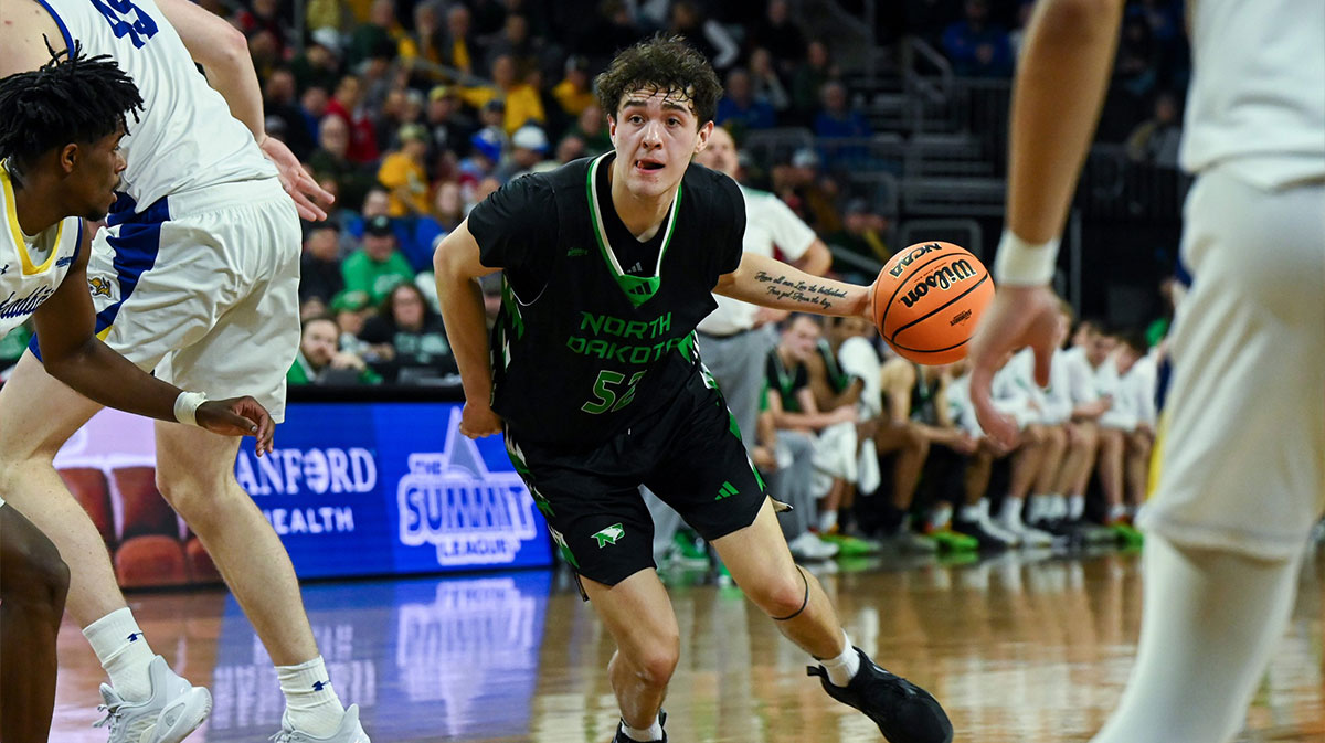 North Dakota Fighting Hawks basketball guard Treysen Eaglestaff (52) moves the ball on Friday, March 7, 2025, at Denny Sanford Premier Center in Sioux Falls, S.D.