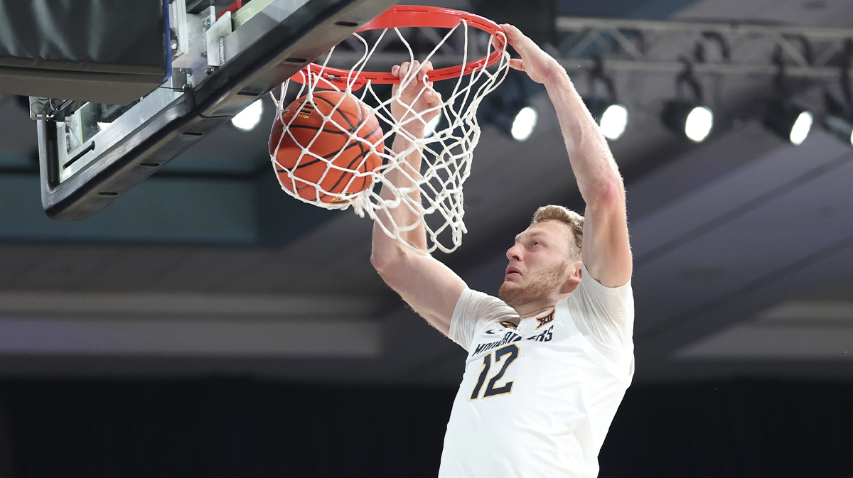 West Virginia Mountaineers guard Tucker DeVries (12) dunks during the first half against the Gonzaga Bulldogs at the Atlantis Resort.