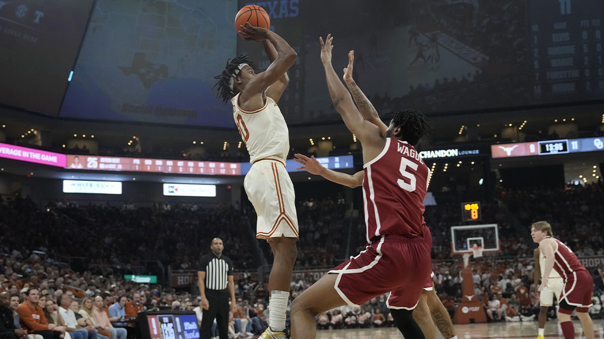 exas Longhorns guard Tre Johnson (20) shoots over Oklahoma Sooners forward Mohamed Wague (5) during the first half at Moody Center.