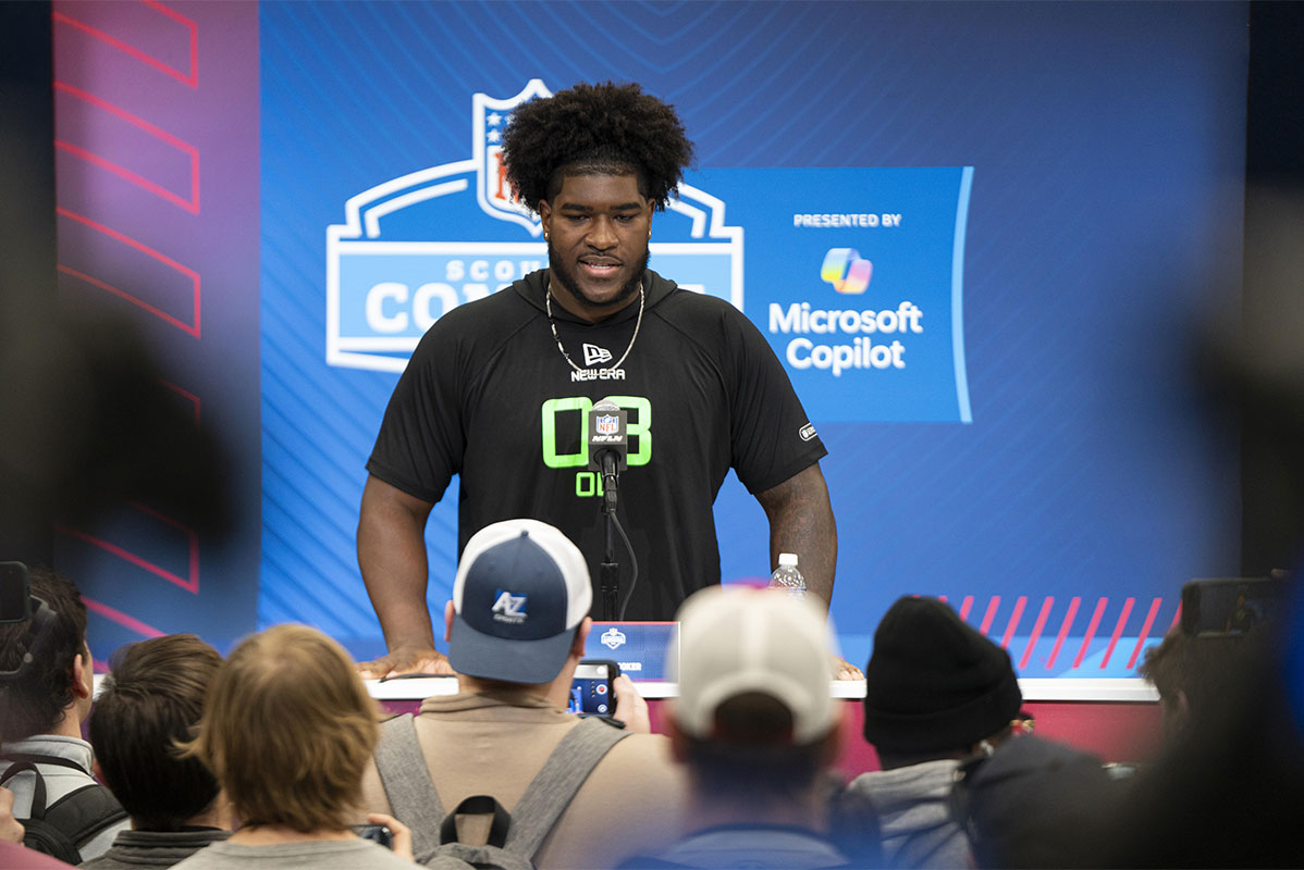 University of Alabama offensive lineman Tyler Booker (OL03) answers questions at a press conference during the 2025 NFL Combine at Indiana Convention Center.