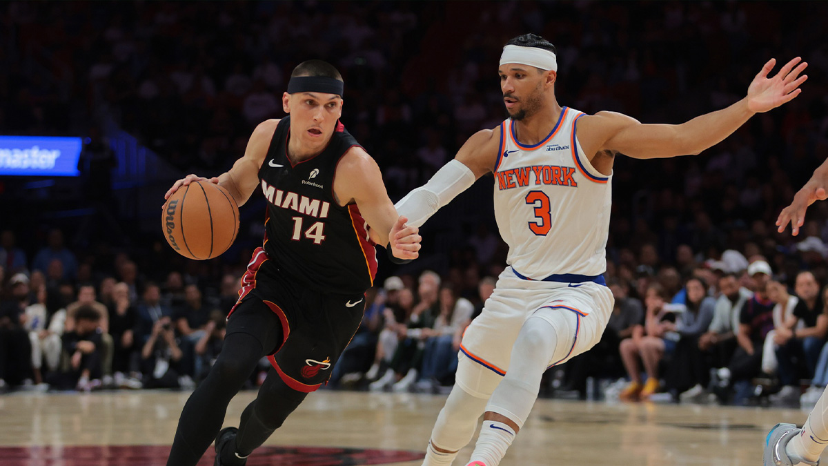 Miami Heat guard Tyler Herro (14) drives to the basket past New York Knicks guard Josh Hart (3) during overtime at Kaseya Center.