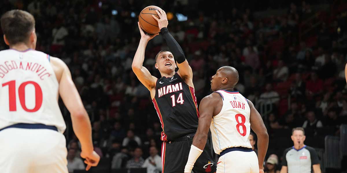 Miami Heat guard Tyler Herro (14) shoots over LA Clippers guard Kris Dunn (8) during the second half at Kaseya Center.