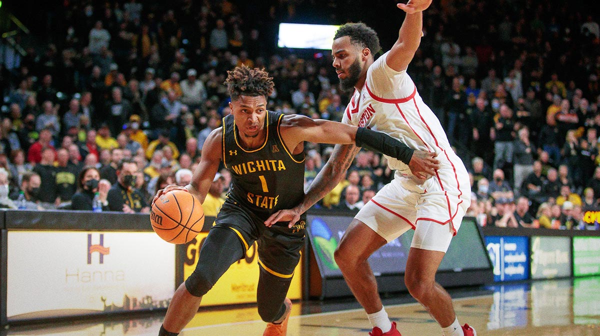 Vichita State Shockers Guard Tyson Etienne (1) Drive around Houston Cougars Guard Kiler Edwards (11) during the second half in Charles Koch Arena.