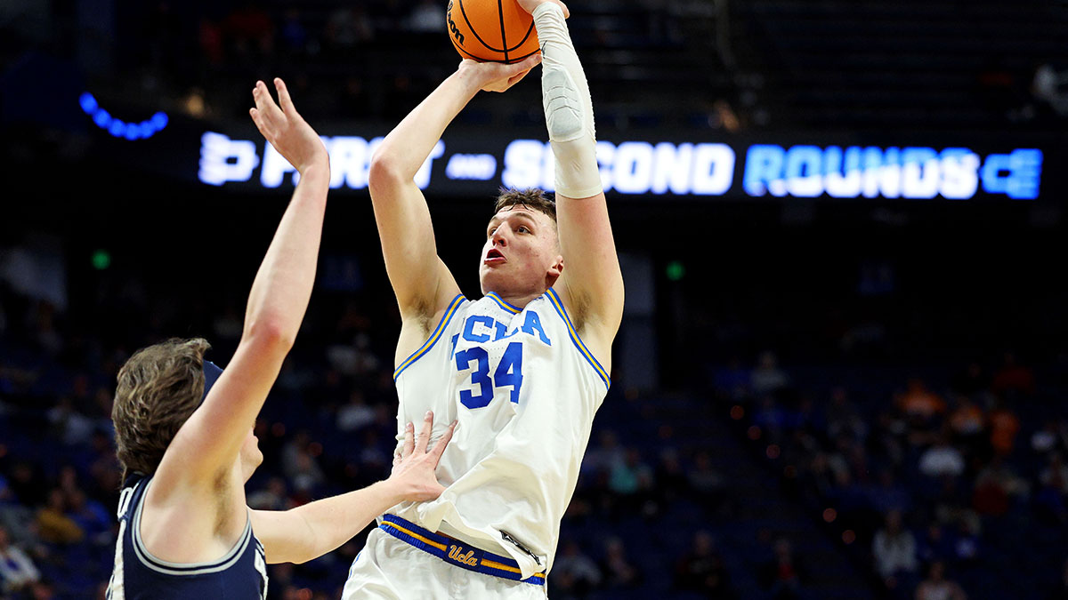 UCLA Bruins forward Tyler Bilodeau (34) shoots the ball against Utah State Aggies center Isaac Johnson (20) during the second half in the first round of the NCAA Tournament at Rupp Arena.