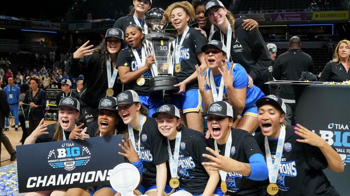UCLA women's basketball players celebrate after defeating the USC Trojans during the 2025 TIAA Big Ten Women's Basketball Tournament final on Sunday, March 9, 2025, at Gainbridge Fieldhouse in Indianapolis. UCLA defeated USC 72-67.