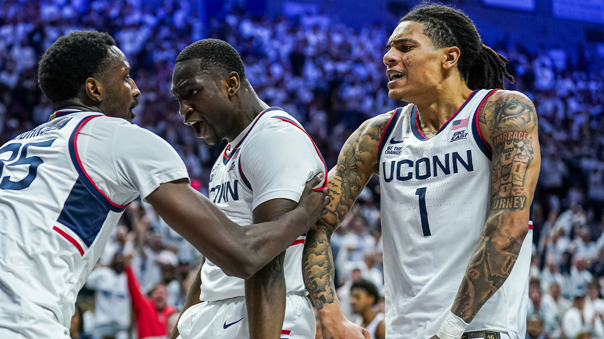 UConn Huskies guard Hassan Diarra (10) and guard Solo Ball (1) react after center Samson Johnson (35) makes a basket against the Marquette Golden Eagles in the second half at Harry A. Gampel Pavilion.